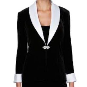 Velvet jacket with satin lapel, chiffon sleeves,& embellished brooch closure.